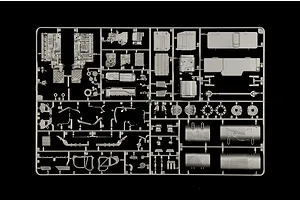 Grey plastic model parts sprue containing truck engine and chassis components on a black background.