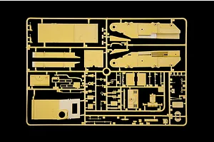 Tan plastic model kit sprue containing various unbuilt vehicle parts and panels against a black background.
