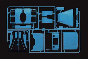 Light blue plastic model kit sprue featuring truck cab body panels and components against a black background.
