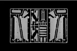 Grey plastic model kit parts sprue featuring aircraft wing sections and structural components on a black background.