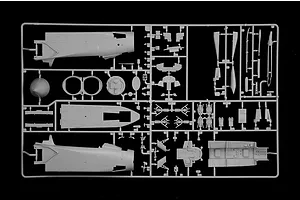 Grey plastic model kit sprue containing various aircraft parts and fuselage sections on a plain black background.