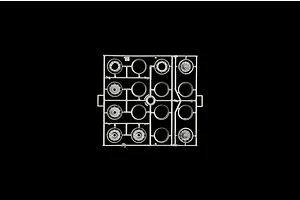 A grey plastic model sprue featuring various scale truck wheel rims and hub components on a solid black background.