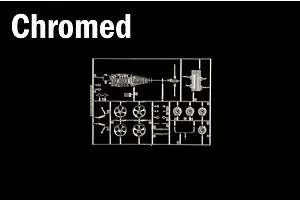 A sprue of chromed plastic parts including wheels and mechanical components for a model kit against a black background.