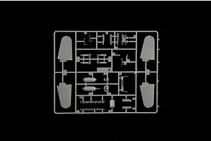 Grey plastic model kit sprue containing aircraft parts, wing sections, and ordnance components on a black background.