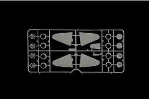 Grey plastic model sprue featuring aircraft parts such as engine cowlings, wheels, and control surfaces against a black background.
