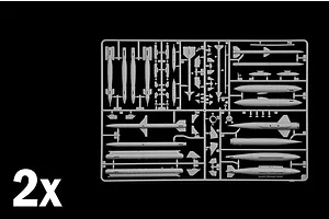 Grey plastic model kit sprue containing various weapon parts and missiles, labeled with a 2x indicator in the corner.