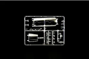 Clear plastic model kit sprue containing aircraft canopy and transparent parts set against a black background.
