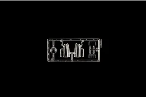Clear plastic model kit sprue containing transparent canopy and window parts on a black background.