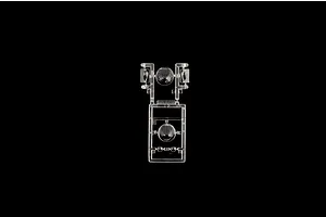 Clear plastic model kit sprue containing transparent windows and turrets on a plain black background.