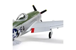 Close-up studio shot of the cockpit and wing of a silver and green E-Flite P-47 Thunderbolt RC warplane.