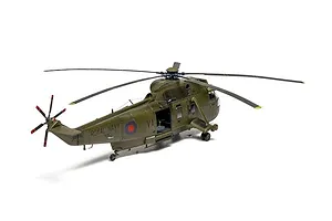 Completed Airfix 1/48 scale model of a Royal Navy Westland Sea King HC.4 helicopter in olive green livery against a white background.