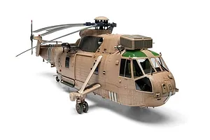 A completed and painted 1/48 scale model of a Westland Sea King HC.4 military helicopter in desert camouflage against a plain white background.