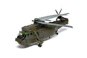 Completed Airfix 1/48 scale Westland Sea King HC.4 helicopter plastic model painted in military green against a white background.