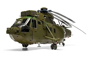 A studio shot of the Airfix 1/48 scale Westland Sea King HC.4 plastic model helicopter finished in military green livery against a white background.