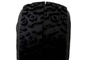 Close-up studio shot of a black RC monster truck tyre showing the tread pattern and rubber compound against a white background.