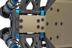 Close-up studio shot of the Team Associated RC10B84.1D 4WD RC buggy chassis highlighting the anodized aluminum chassis plate, blue accents, suspension arms, and shock absorbers.