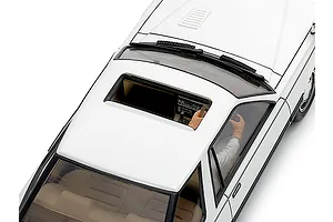 Top-down view of the Tamiya 1/24 Nissan Leopard model car highlighting the sunroof, interior dashboard, and driver figure.
