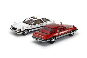 Two completed 1/24 scale Tamiya Nissan Leopard model cars in white and red against a white background.