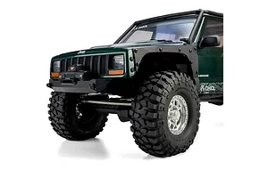 Front-three-quarter closeup of the green Axial SCX10 III Jeep Cherokee XJ RC rock crawler showing scale details.