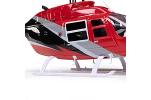 Close-up studio shot of the red, black, and white fuselage and landing skids of the Blade Jet Ranger 235CP RC helicopter.