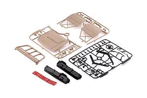 Killerbody 1/10 Toyota Land Cruiser 70 hard body kit parts laid out on a white background, including desert yellow panels and black detail sprues.