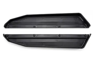 Two black molded plastic chassis guards shown against a plain white background.