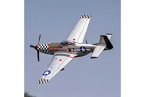 E-Flite P-51D Mustang Big Beautiful Doll RC plane in flight against a clear sky, showing silver fuselage and checkered nose.