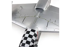 Close-up top view of the silver wing and fuselage section of the E-Flite P-51D Mustang RC airplane, showing checkered tail markings and air scoop.