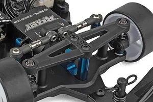 Close-up view of the front suspension, steering linkage, and Reedy Power servo on an RC car.