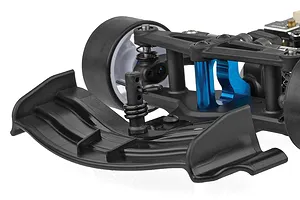 Close-up view of the front suspension, black front wing, and blue anodized accents on an RC car against a white background.
