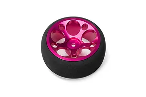 Spektrum aluminium wide circle wheel in pink with a black foam tyre against a white background.