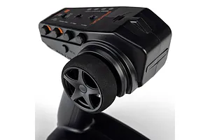 Close-up studio shot of the steering wheel and top control panel of a black Spektrum RC transmitter against a white background.