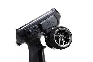 Spektrum aluminium wide spoke transmitter wheel installed on a black RC radio controller against a white background.