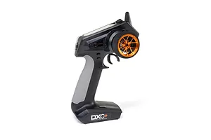 Spektrum radio transmitter with an orange wide spoke aluminium steering wheel installed, shown against a white background.