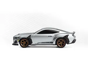 Studio side profile of the silver HPI Nano-TTR Ford Mustang Spec 5 RC car featuring bronze wheels and black body accents.