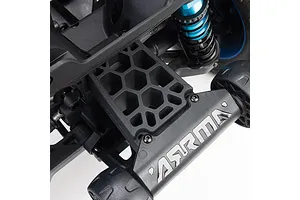 Close-up of ARRMA RC car chassis showing honeycomb support structure and branded bumper with wheels.
