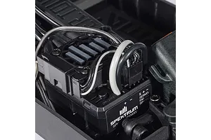 Close-up of a Spektrum electronic speed controller and cooling fan mounted inside an ARRMA RC car chassis.