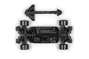 Top-down view of an assembled RC car chassis and a separate plastic chassis brace on a white background.
