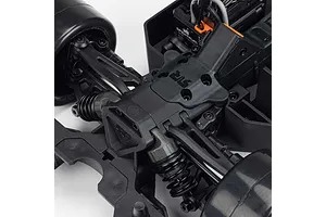 Close-up top down studio view of the front suspension, shock absorbers, and electronics chassis layout on an ARRMA RC car.