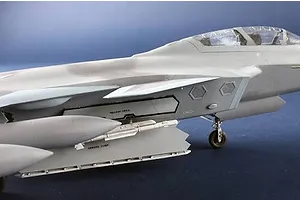 Close-up of a 1/48 scale model kit of the Chinese J-20S jet showing the cockpit and weapon bay.