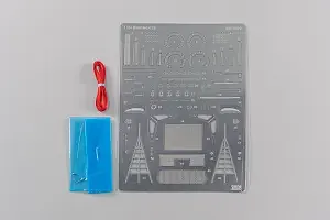 NuNu 1/24 BMW M6 GT3 detail up parts set including a photo-etched metal sheet, red cord, and blue material on a white background.