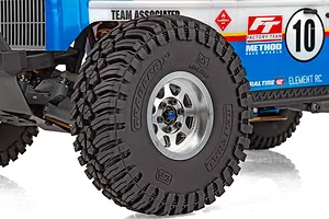 Close-up of front wheel and tyre with aggressive tread pattern on the Element RC Gaterunner RC trophy truck.