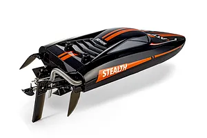 Rear-angle studio shot of the Atrek Stealth black and orange RC speed boat showing the propeller and rudder assembly.