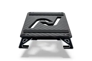 INOV8 3DX carbon fibre RC car stand with silver accents, viewed from a low angle on a white background.