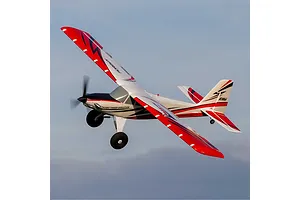 E-Flite Turbo Timber Evolution 1.5m RC plane in flight against a blue sky background.