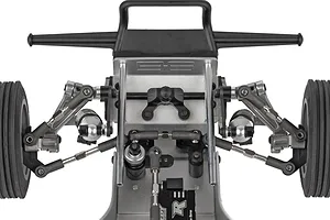 Close-up top-down view of the front suspension, steering components, bumper, and ribbed tires on the Team Associated RC10 Ultra Rider buggy.