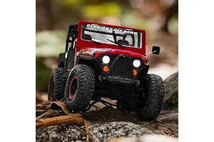 Axial SCX30 Jeep CJ-7 Renegade RC rock crawler in red navigating an outdoor rocky and dirt trail.