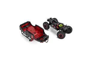 Axial SCX30 Jeep RC crawler shown with its red body shell detached from the black chassis and drivetrain.