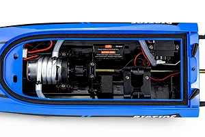 Top-down view of the inside hull of the Atrek Riptide RC speed boat, showing the motor, cooling lines, steering servo, and wiring.