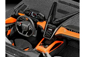 Detailed interior view of a built Revell 1/24 scale Lamborghini Revuelto model car, showing the dashboard, steering wheel, and center console.